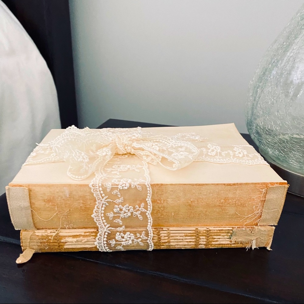 Old decorative books with lace